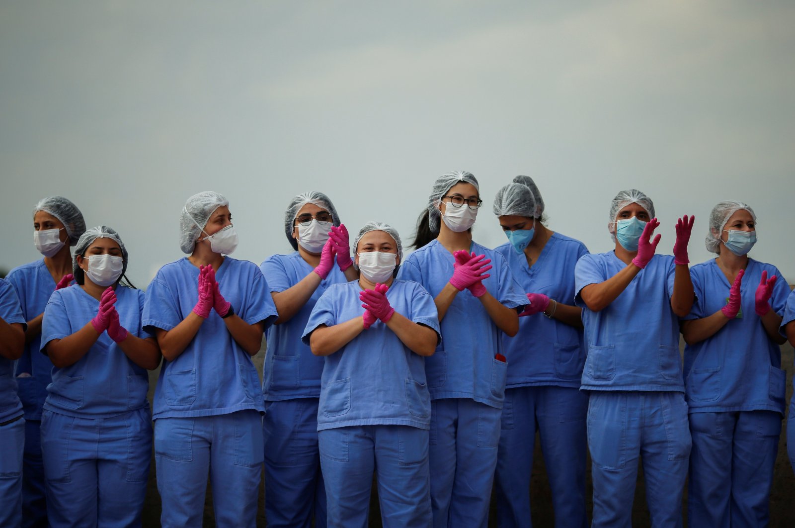 Health care workers celebrate as the last COVID-19 patients leave a temporary field hospital in Brasilia, Brazil, Oct. 15, 2020. (Reuters Photo)