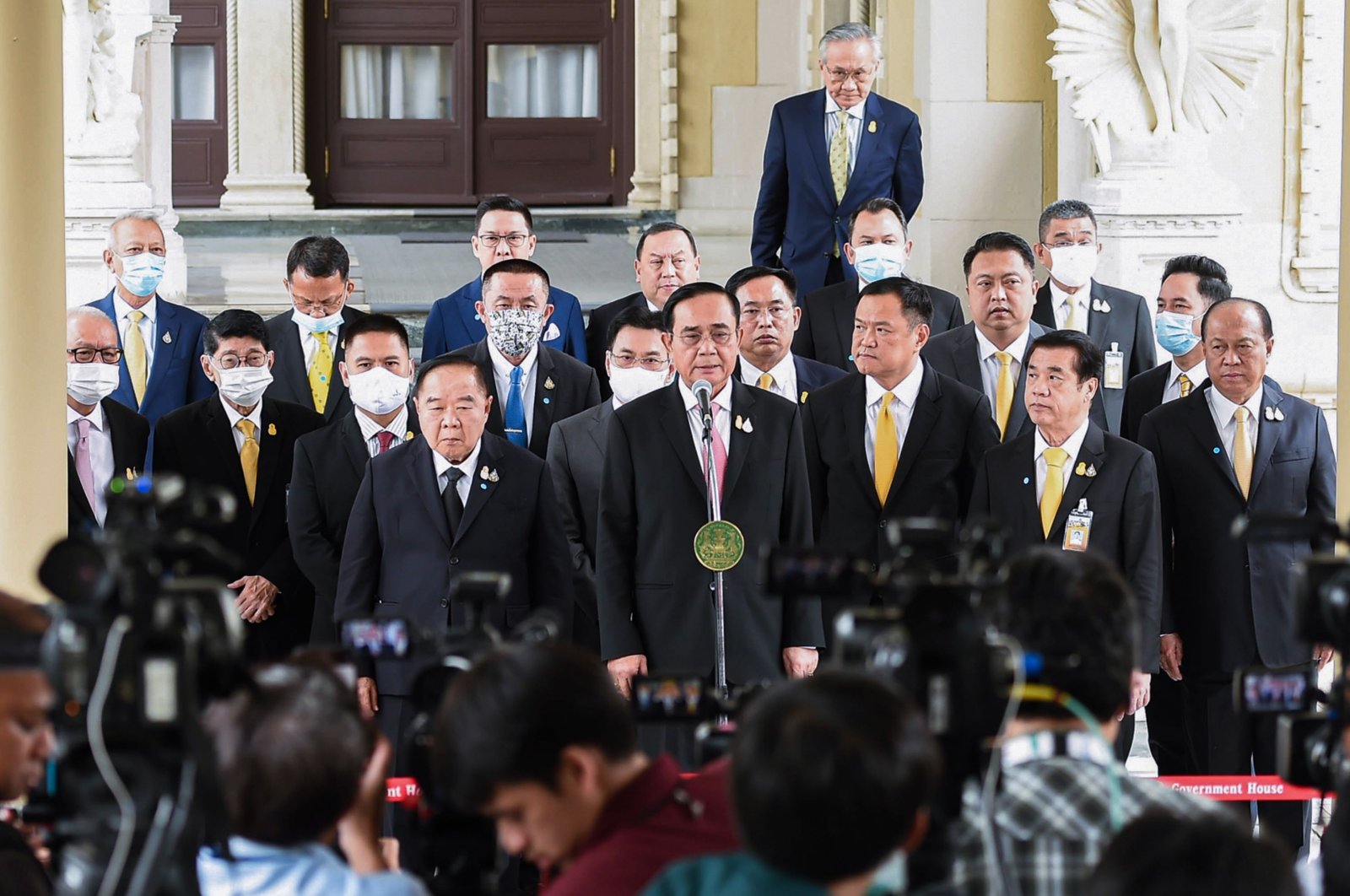 Thailand's Prime Minister Prayut Chan-O-Cha speaking at a press conference at the Government House in Bangkok while cabinet ministers look on following a cabinet meeting on Oct. 16, 2020. (Royal Thai government Photo via AFP)