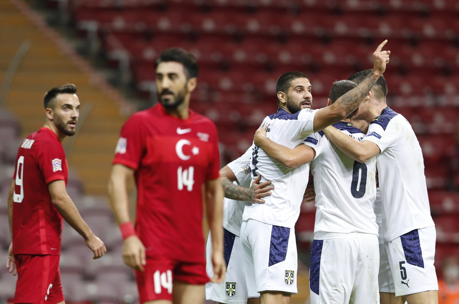 Turkey's Kenan Karaman (L) and Mahmut Takdemir react as Serbian players celebrate scoring a goal during a UEFA Nations League match, in Istanbul, Turkey, Oct. 14, 2020. (Reuters Photo)
