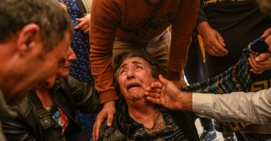 Relatives of Royal Sahnazarov, his wife Zuleyha Sahnazarova and their daughter Medine Sahnazorava, who were killed when an Armenian rocket hit their home, mourn during their funeral in the city of Ganja, Azerbaijan, on October 17, 2020 during fighting over the breakaway region of Nagorno-Karabakh. (AFP photo)
