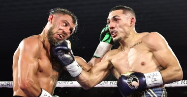 Vasiliy Lomachenko (L) fights Teofimo Lopez in their Lightweight World Title bout in Las Vegas, Nevada, U.S., Oct. 17, 2020. (Getty Images)