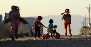 Displaced Iraqi children from the minority Yazidi sect, who fled the Iraqi town of Sinjar, play at the Khanki camp on the outskirts of Dohuk province, July 31, 2019. (REUTERS Photo)