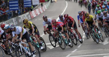 Cyclists ride through the Spanish capital during the Vuelta cycling race in Madrid, Spain, Sept. 2019. (AP Photo)
