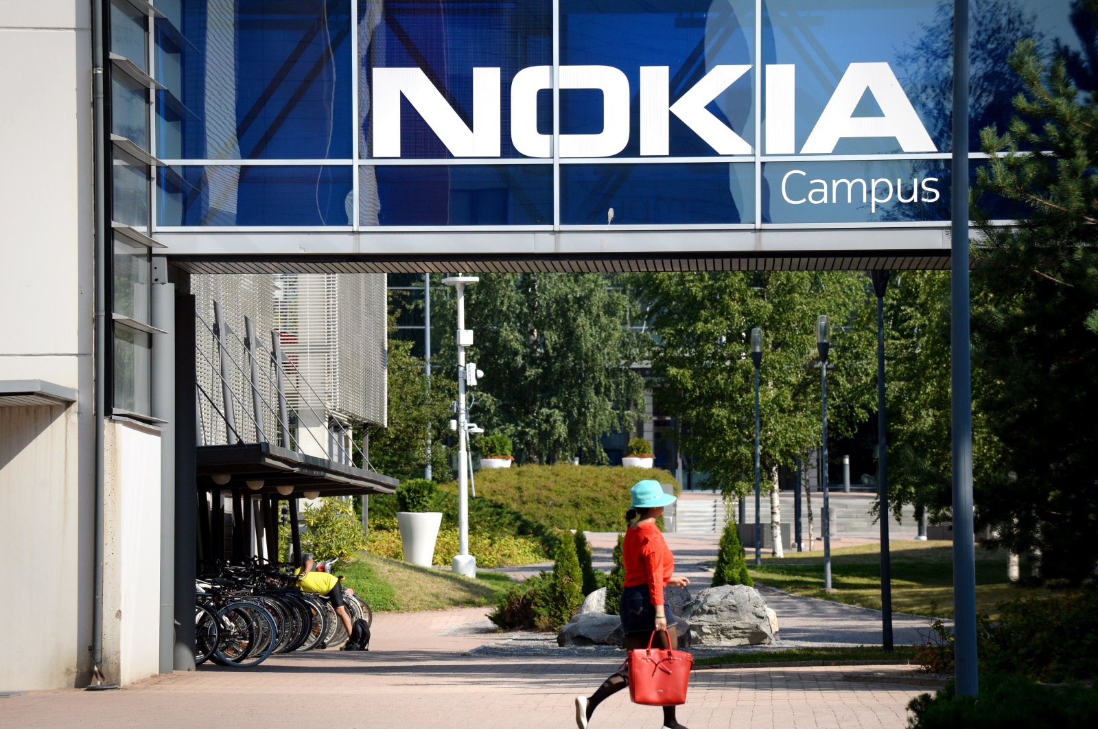 A woman walks at the headquarters of Finnish telecommunication network company Nokia in Espoo, Finland, July 26, 2018. (AP Photo)