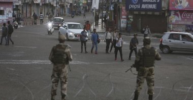 Indian paramilitary soldiers stand guard during curfew-like restrictions in Jammu, India, Aug. 5, 2019. (AP Photo)