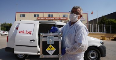 A health care worker carries a radioactive drug at the airport in Gaziantep, southern Turkey, Oct. 20, 2020. (AA Photo)