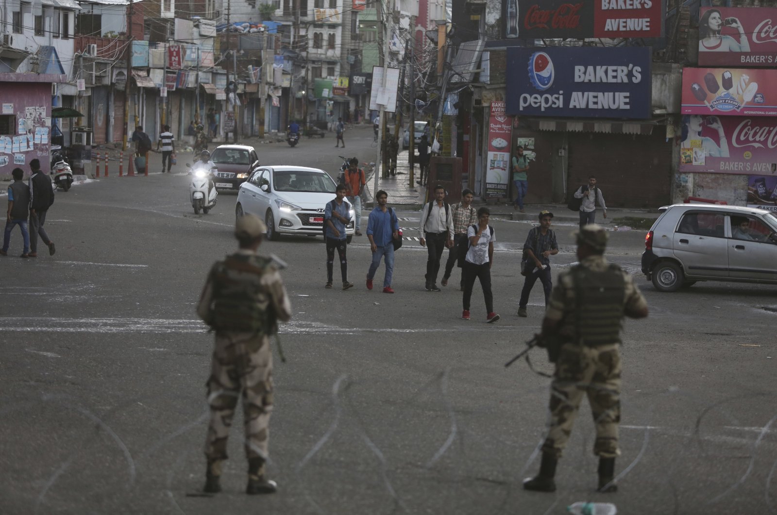 Indian paramilitary soldiers stand guard during curfew-like restrictions in Jammu, India, Aug. 5, 2019. (AP Photo)