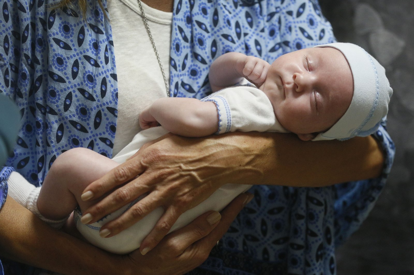 Andreo Diez, from Buenos Aires, Argentina, holds Ignacio, her baby born via a Ukrainian surrogate mother, after spending two weeks in quarantine, due to the coronavirus outbreak, in Kyiv, Ukraine, June 10, 2020. (AP Photo)