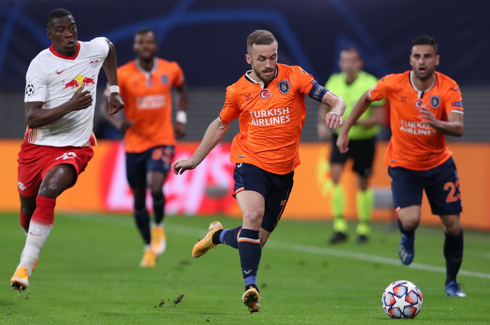 Istanbul Başakşehir's Bosnian midfielder Edin Visca (C) gets past Leipzig's French defender Nordi Mukiele (L) with the ball during a Group H Champions League football match between RB Leipzig and Istanbul Başakşehir at the RB Arena in Leipzig, Germany, Oct. 20, 2020. (AFP Photo)