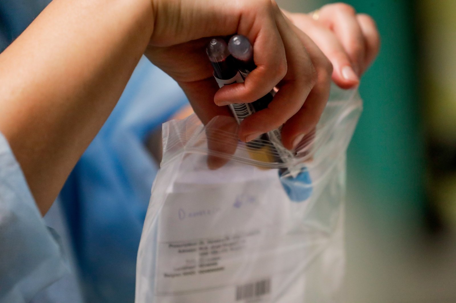 A nurse packs samples after drawing blood from a coronavirus patient in the COVID-19 hospitalization unit at the Etterbeek-Ixelles site of the Iris Sud Hospitals in Brussels, Belgium, Oct. 21, 2020. (EPA Photo)