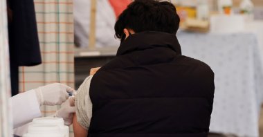 A man gets an influenza vaccine at a hospital in Seoul, South Korea, Oct. 21, 2020. (Reuters Photo)