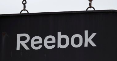 A board with a Reebok store logo is seen in a shopping center at the outlet village Belaya Dacha outside Moscow, Russia, April 23, 2016.  (Reuters Photo)