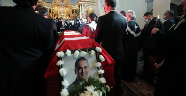 President Recep Tayyip Erdoğan and mourners stand by the coffin of Markar Esayan at Surp Asdvadzadzin Patriarchal Church in Istanbul, Turkey, Oct. 22, 2020. (AA Photo)