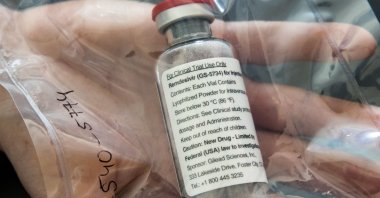 In this file photo taken on April 8, 2020 one vial of the drug Remdesivir is seen during a press conference about the start of a study with the Ebola drug Remdesivir in particularly severely ill patients at the University Hospital Eppendorf (UKE) in Hamburg, northern Germany, amidst the new coronavirus COVID-19 pandemic. (AFP Photo)