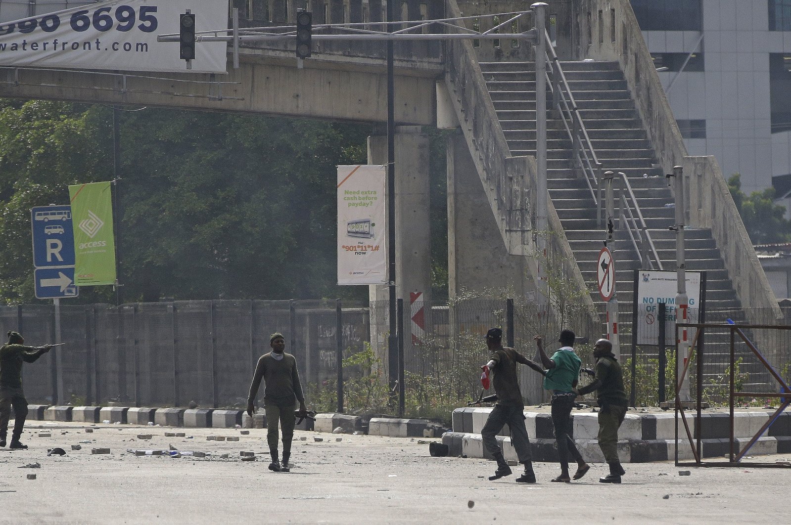 Police officers detain a protester at the Lekki toll gate in Lagos, Nigeria, Oct. 21, 2020. (AP Photo)
