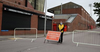 A steward is seen outside the stadium before the match, as play resumes behind closed doors following the coronavirus outbreak, Aug. 1, 2020. (Reuters Photo)