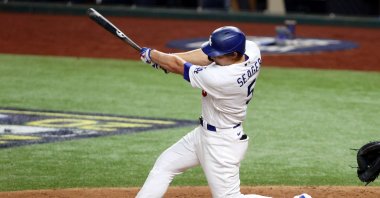 Corey Seager of the Los Angeles Dodgers hits a solo home run against the Tampa Bay Rays during the Game Two of the 2020 MLB World Series in Arlington, Texas, Oct. 21, 2020. (AFP Photo)