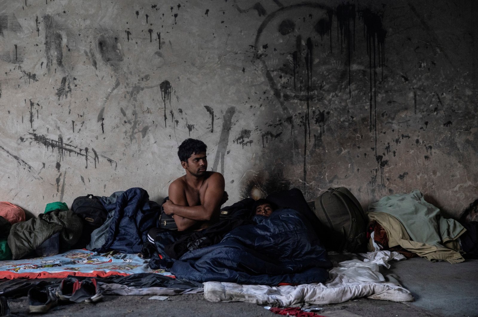 Migrants rest inside an abandoned factory near Velika Kladusa, Bosnia-Herzegovina, Sept. 30, 2020. (REUTERS Photo)
