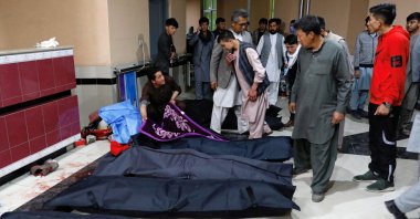 Afghan men look for their relatives at a hospital after a suicide bombing in Kabul, Afghanistan Oct. 24, 2020. (Reuters Photo)