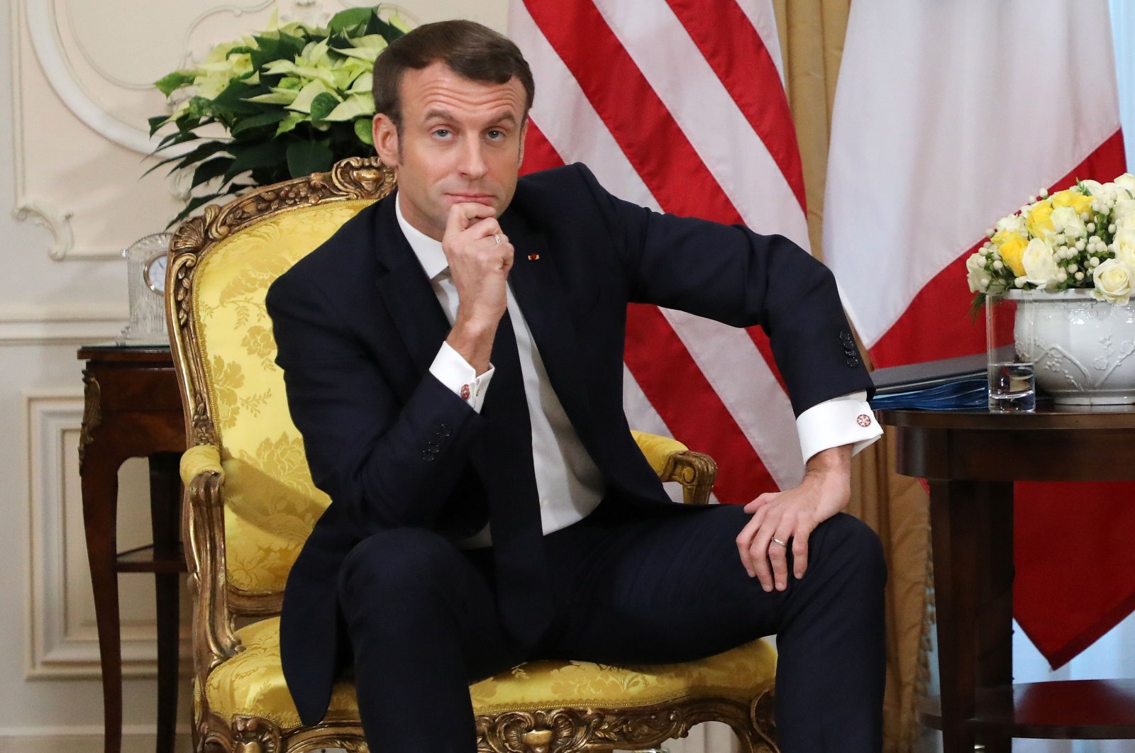 France's President Emmanuel Macron reacts as he talks with U.S. President Donald Trump during their meeting at Winfield House, London on Dec. 3, 2019. (AFP Photo)