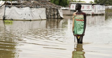 A girl walks in water after heavy rains and floods forced hundreds of thousands of people to leave their homes, in the town of Pibor, Boma state, South Sudan, Nov. 6, 2019. (REUTERS Photo)