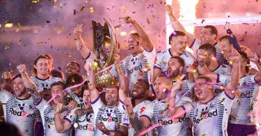 Melbourne Storm players celebrate with the trophy, in Sydney, Australia, Oct. 25, 2020. (REUTERS Photo) 