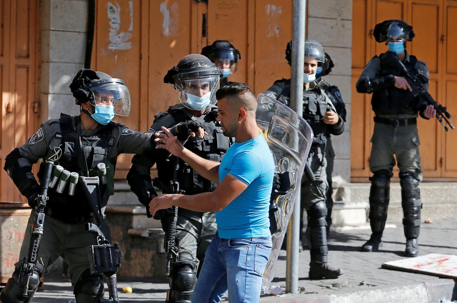 A Palestinian youth scuffles with an Israeli border police officer in the Israeli-occupied West Bank, Oct. 23, 2020. (REUTERS Photo)