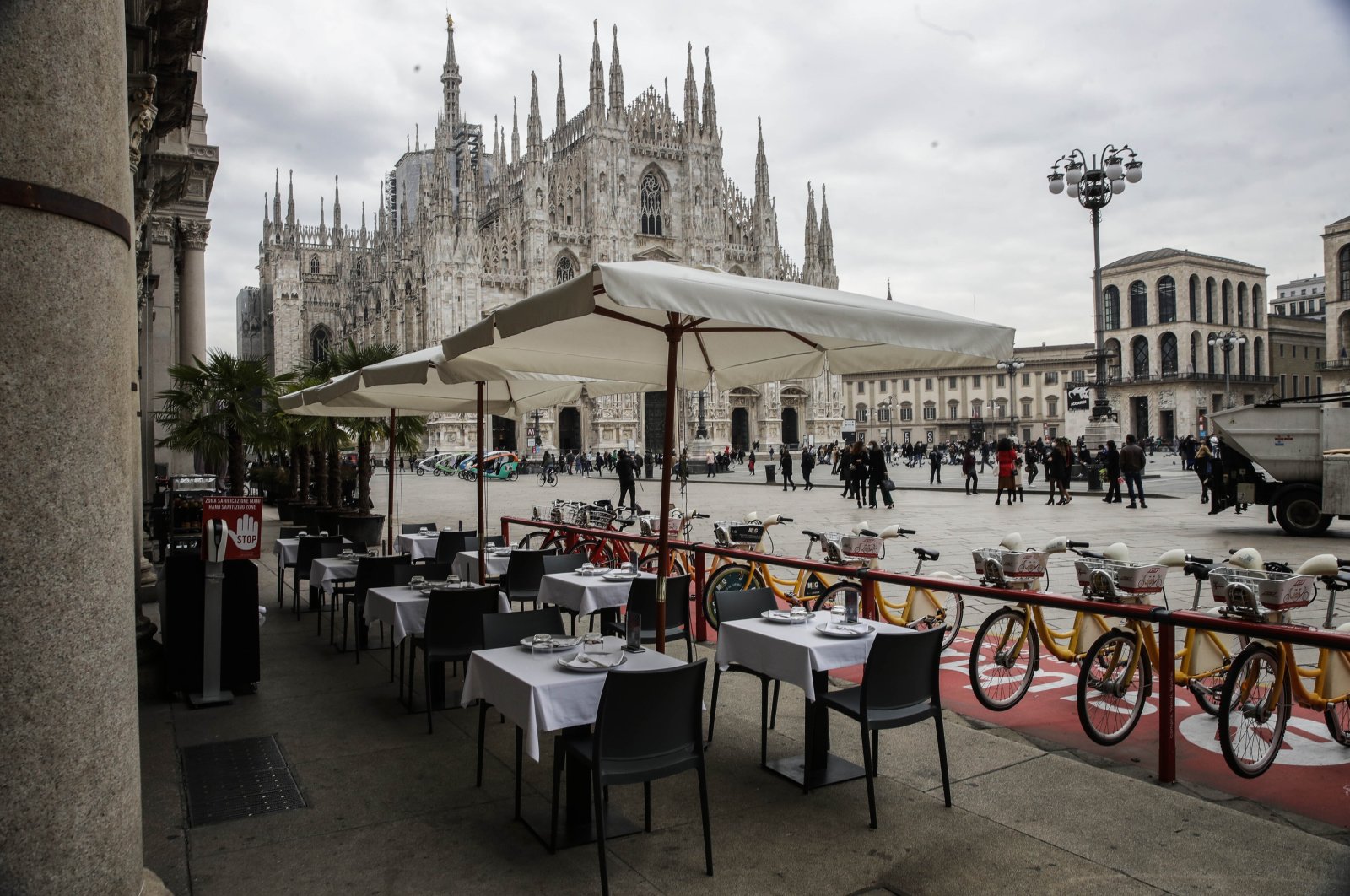 Empty tables of a restaurant in the Duomo Square in Milan, Italy, Oct. 21, 2020. (AP Photo)