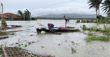 The remains of a house is surrounded by floods in Pola town on the island of Mindoro, central Philippines, Monday, Oct. 26, 2020.  (AP Photo)