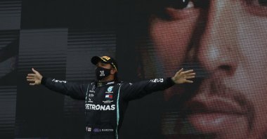 Mercedes driver Lewis Hamilton celebrates after winning the Formula One Portuguese Grand Prix in Portimao, Portugal, Oct. 25, 2020. (AP Photo)