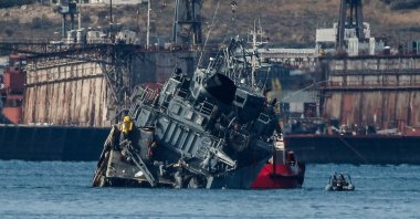 This photo shows the Greek Navy minesweeper Kallisto towed back to the naval base, after colliding with the Portuguese cargo ship Maersk Launceston outside the port of Piraeus in Athens, Oct. 27, 2020. (AFP Photo)