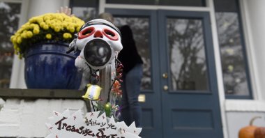 Carol McCarthy sends candy down the candy chute that she will use to give out treats to socially-distant trick-or-treaters on Halloween, Monday, Oct. 26, 2020, in Palmyra, N.J. (AP Photo)