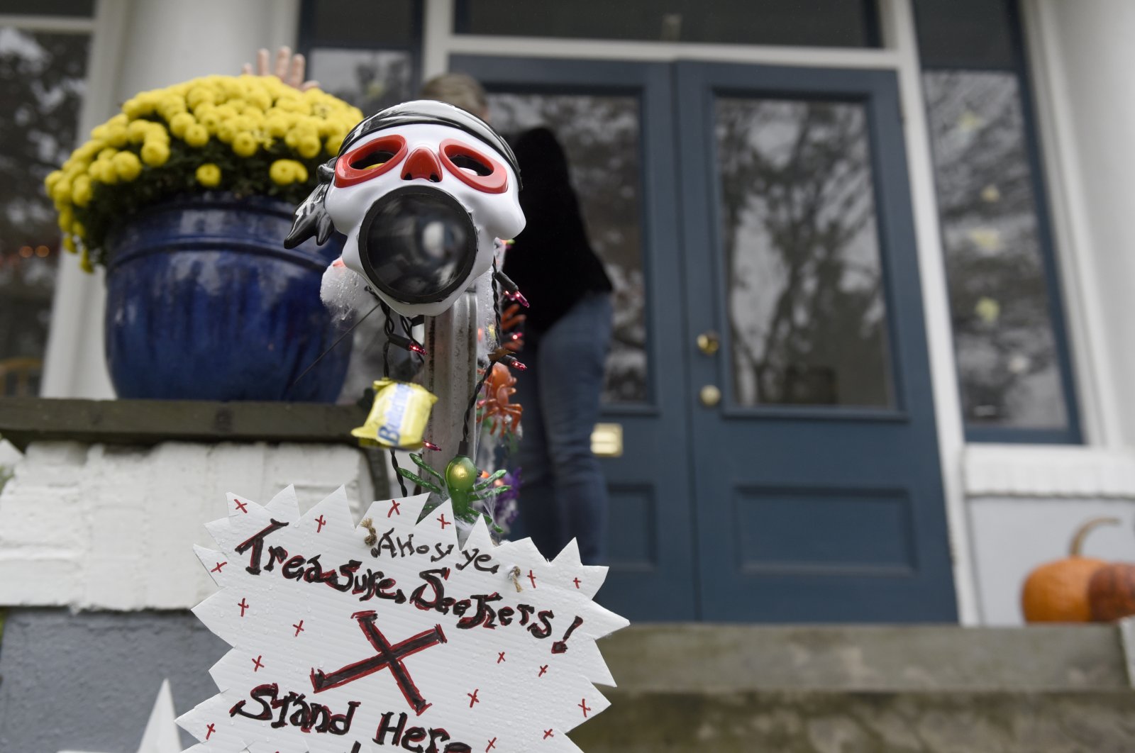 Carol McCarthy sends candy down the candy chute that she will use to give out treats to socially-distant trick-or-treaters on Halloween, Monday, Oct. 26, 2020, in Palmyra, N.J. (AP Photo)