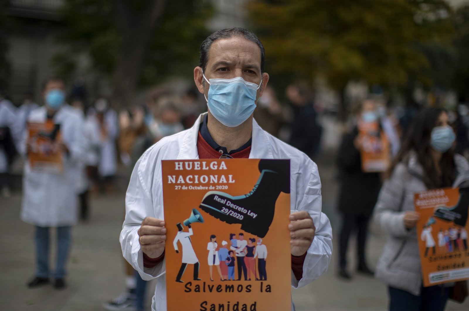 Health services members protest calling for a general strike and demanding more labor protection on their jobs, Madrid, Spain, Oct. 27, 2020. (AP Photo)
