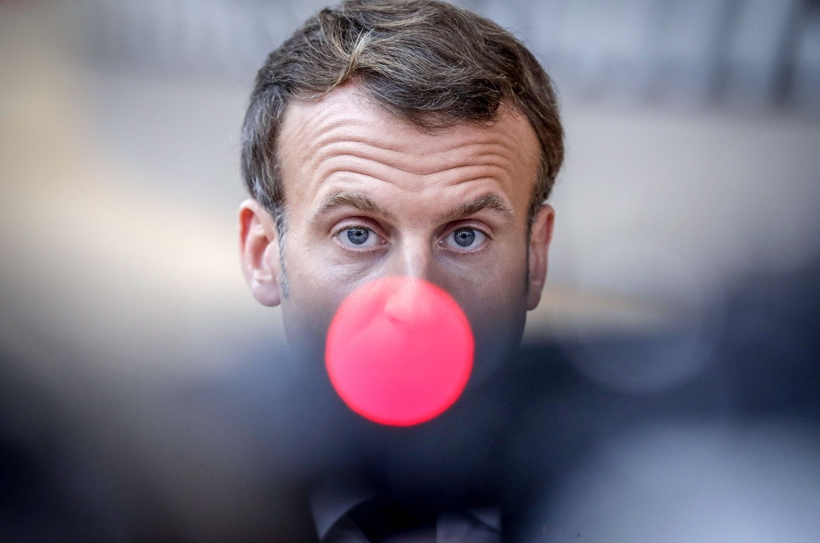 French President Emmanuel Macron, speaks on camera as he arrives ahead of a two days European Union summit at the European Council Building in Brussels, on Oct. 15, 2020. (AFP Photo)