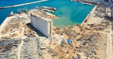 An aerial view of the port of Beirut, the damaged grain silo and the crater caused by the colossal explosion of a huge pile of ammonium nitrate that had languished for years in a port warehouse, leaving scores of people dead or injured and causing devastation in the Lebanese capital, Aug. 9, 2020. (AFP Photo)