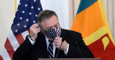 U.S. Secretary of State Mike Pompeo adjusts his facemask during a joint press briefing with Sri Lankan Foreign Minister Dinesh Gunawardena (not pictured) at the Ministry of Foreign Relations in Colombo, Oct. 28, 2020. (AFP Photo)
