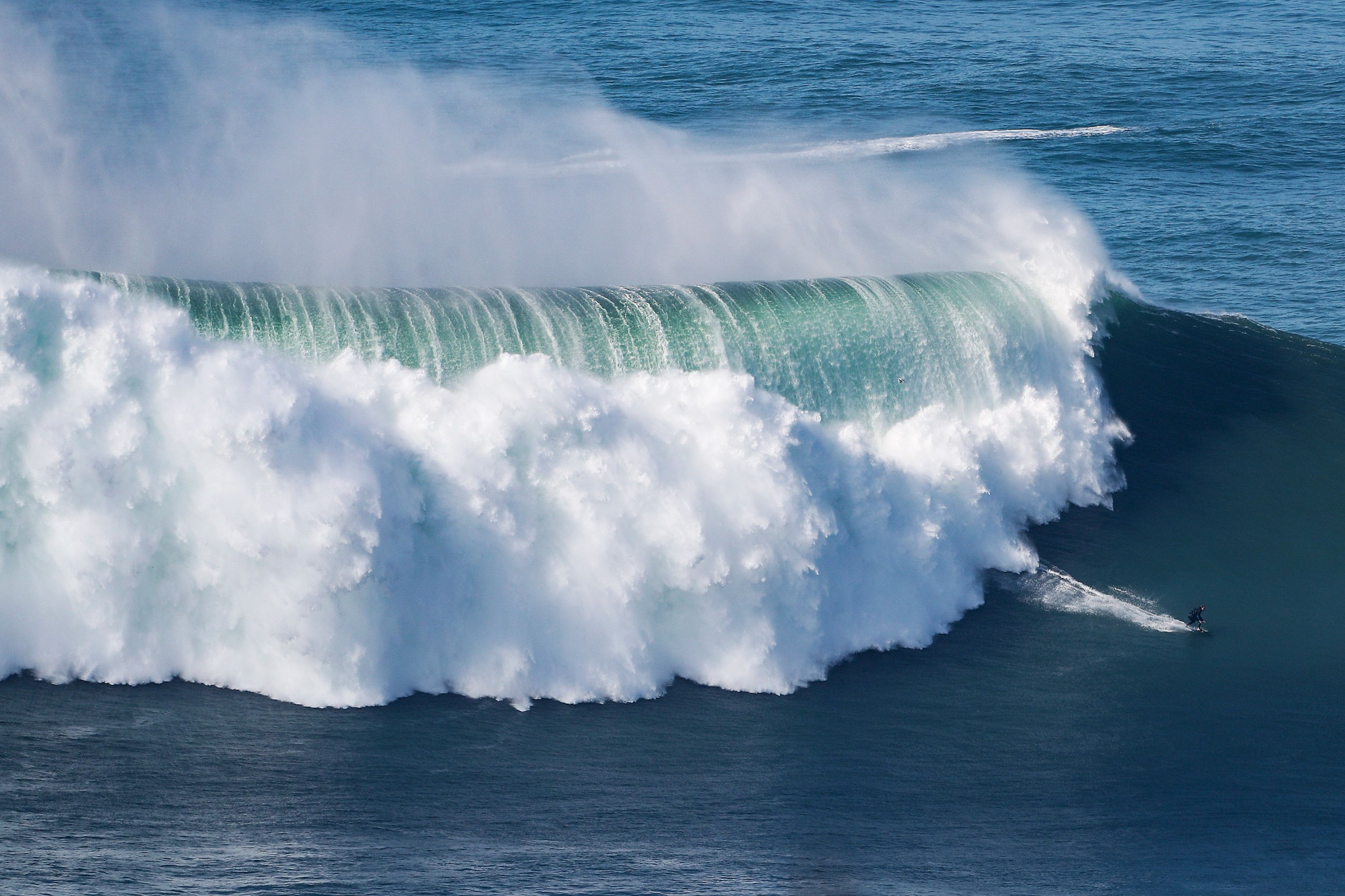Hurricane-generated swell draws big wave surfers to Portugal's