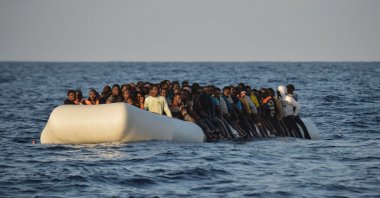 Migrants and refugees on a rubber boat before to be rescued by the ship Topaz Responder run by Maltese NGO Moas and the Red Cross, off the Libyan coast in the  Mediterranean Sea, on Nov. 3, 2016. (AFP Photo)
