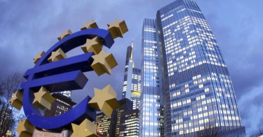 The Euro sculpture stands in front of the European Central Bank, right,  in Frankfurt, Germany, Dec. 16, 2011. ( AP File Photo)