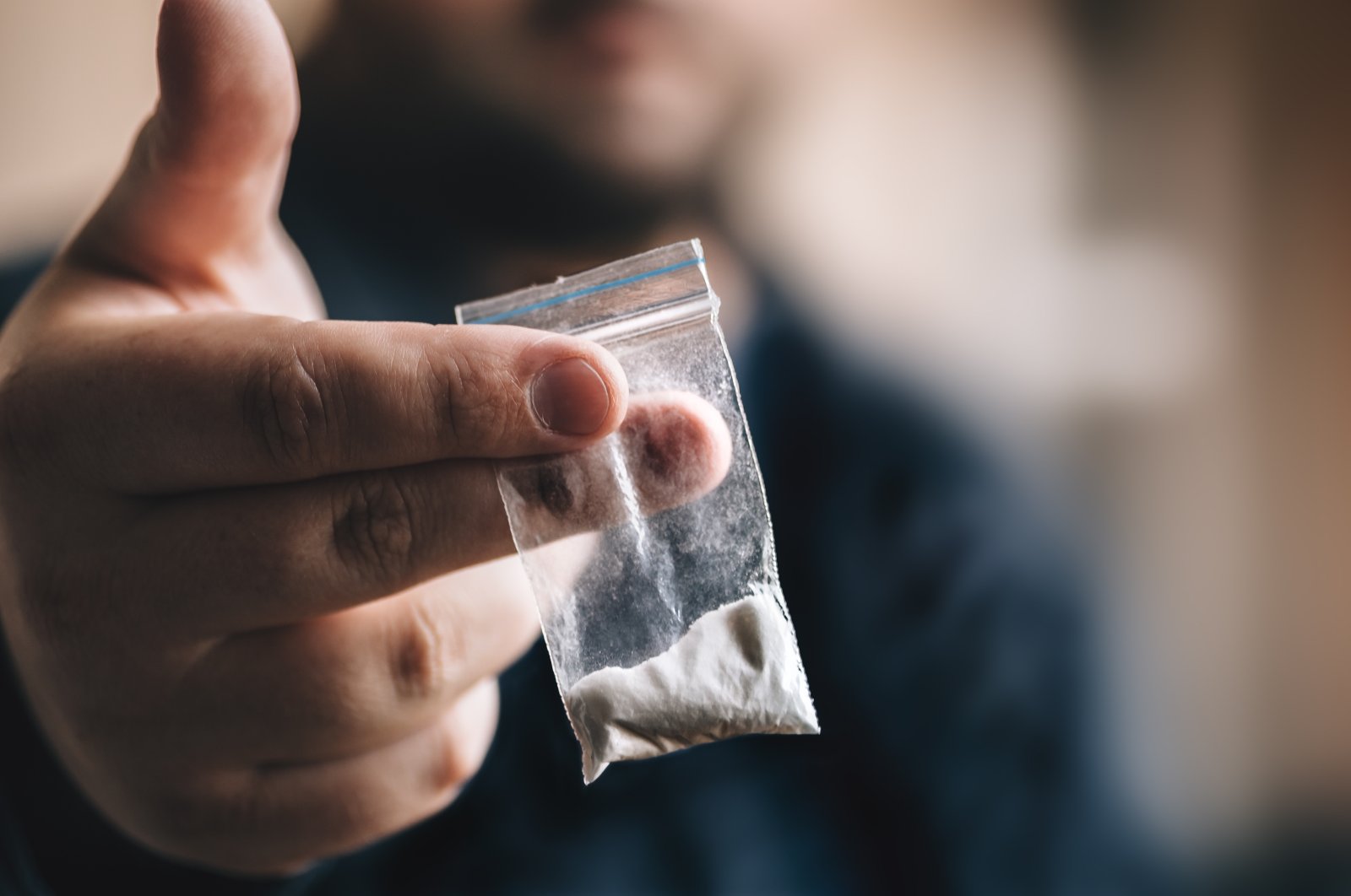 A man holding a ‘small’ amount of cocaine in this file photo. (Shuttestock Photo)