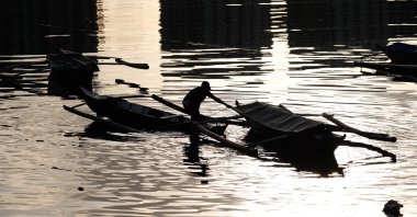 A fisherman secures a boat in preparation for typhoon Goni in Manila, Philippines, Oct. 31, 2020. (EPA Photo)