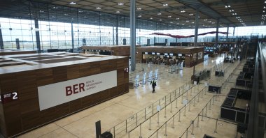 People walk through the Terminal 1 of the new Berlin-Brandenburg-Airport "Willy Brandt" near Berlin in Schoenefeld, Germany, Oct. 27, 2020. (AP Photo)