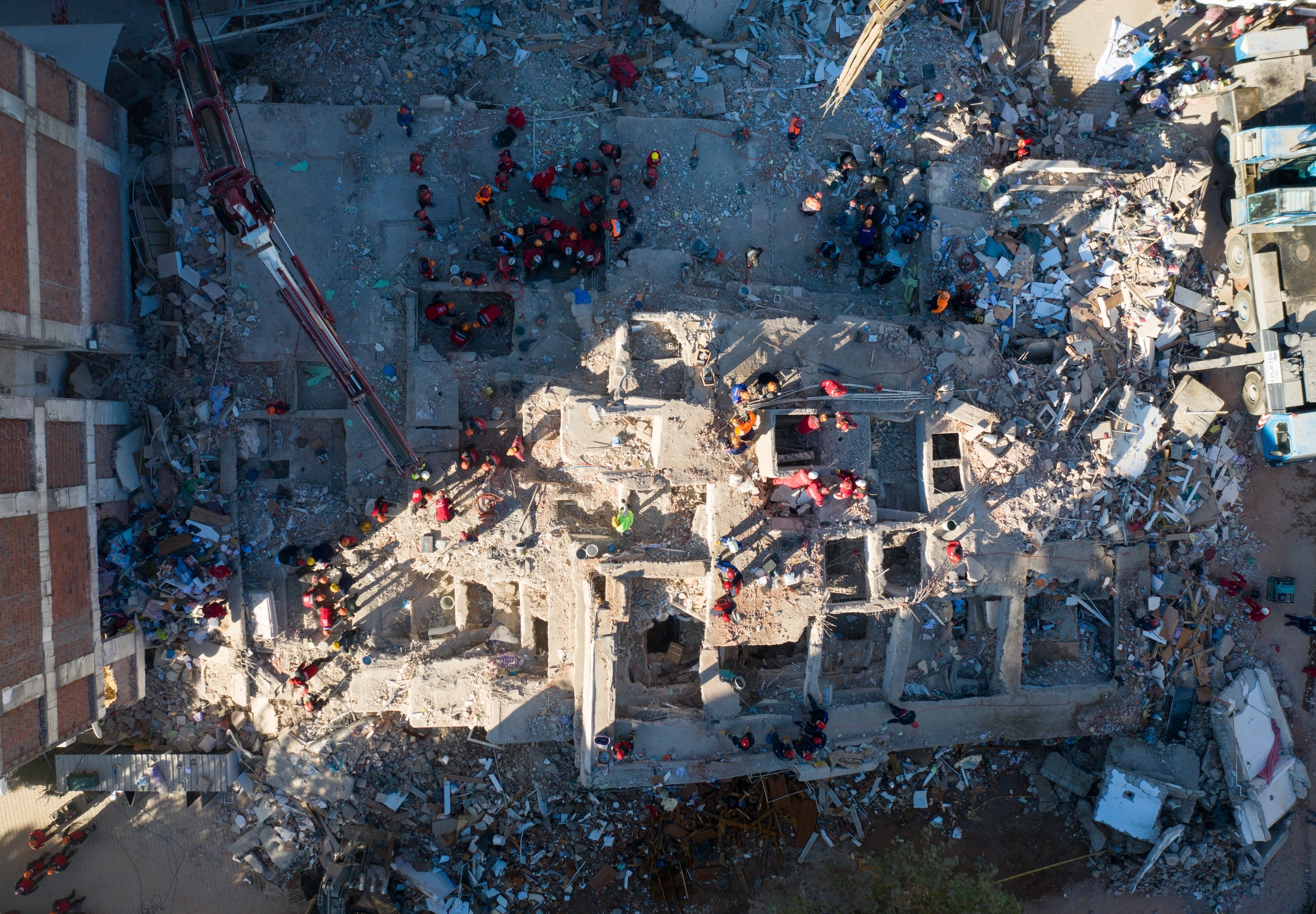 Rescue teams sort through concrete blocs and debris of collapsed buildings in Bornova, Izmir in search of survivors of the powerful earthquake, Nov. 1, 2020. (AA Photo)
