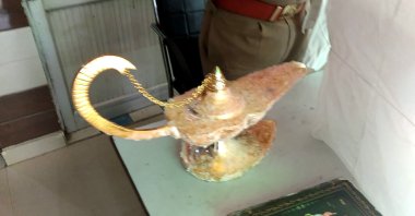 The lamp that was allegedly sold for $93,000 with the claim that it had magical powers, as described in the popular folk tale "Aladdin," at the Brahampuri police station in New Delhi, Oct. 29, 2020. (Uttar Pradesh Police Photo via AFP)