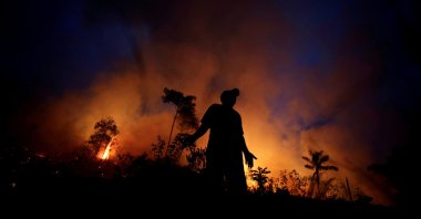 A fire burns as back burning is used to create a firebreak to stop the progress of a fire at a tract of the Amazon jungle in Apui, Amazonas State, Brazil, Aug. 11, 2020. (Reuters Photo)
