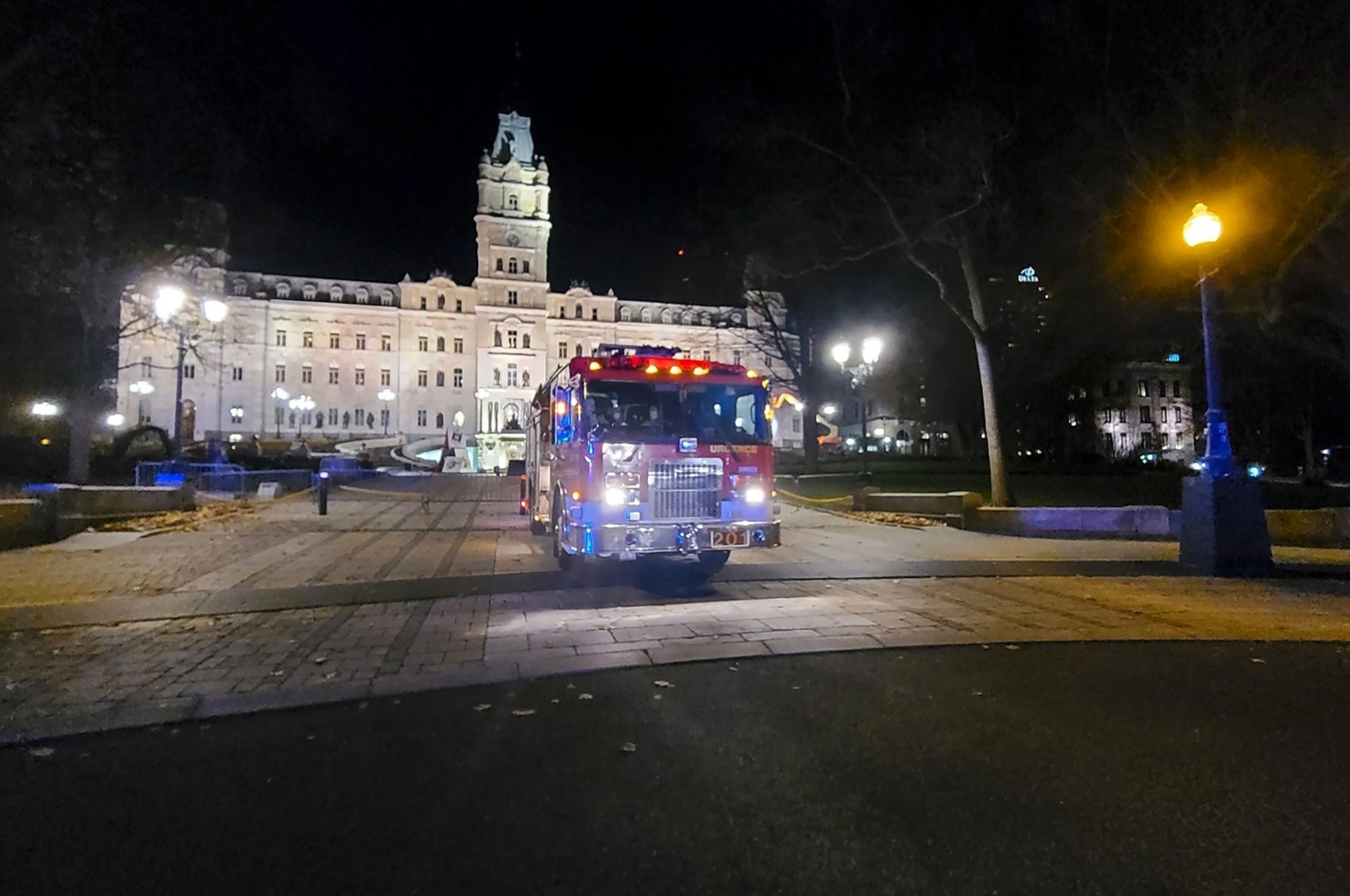 A firetruck is parked in front of the National Assembly of Quebec after two people were killed and five wounded by a sword-wielding suspect dressed in medieval clothing, Quebec City, Nov. 1, 2020. (AFP Photo)