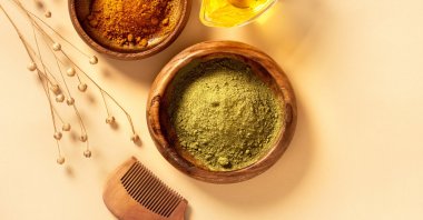 The simplest way to make hair dye out of henna powder is to add some water and oil. (iStock Photo)