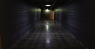 Deniz Gül's "Passage" appears as disconcerting with its dim light and enigmatic structure.  (Courtesy of YKY)