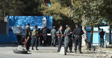 Police stand guard at an entrance gate of Kabul University in Kabul, Afghanistan, Nov. 2, 2020. (AFP Photo)